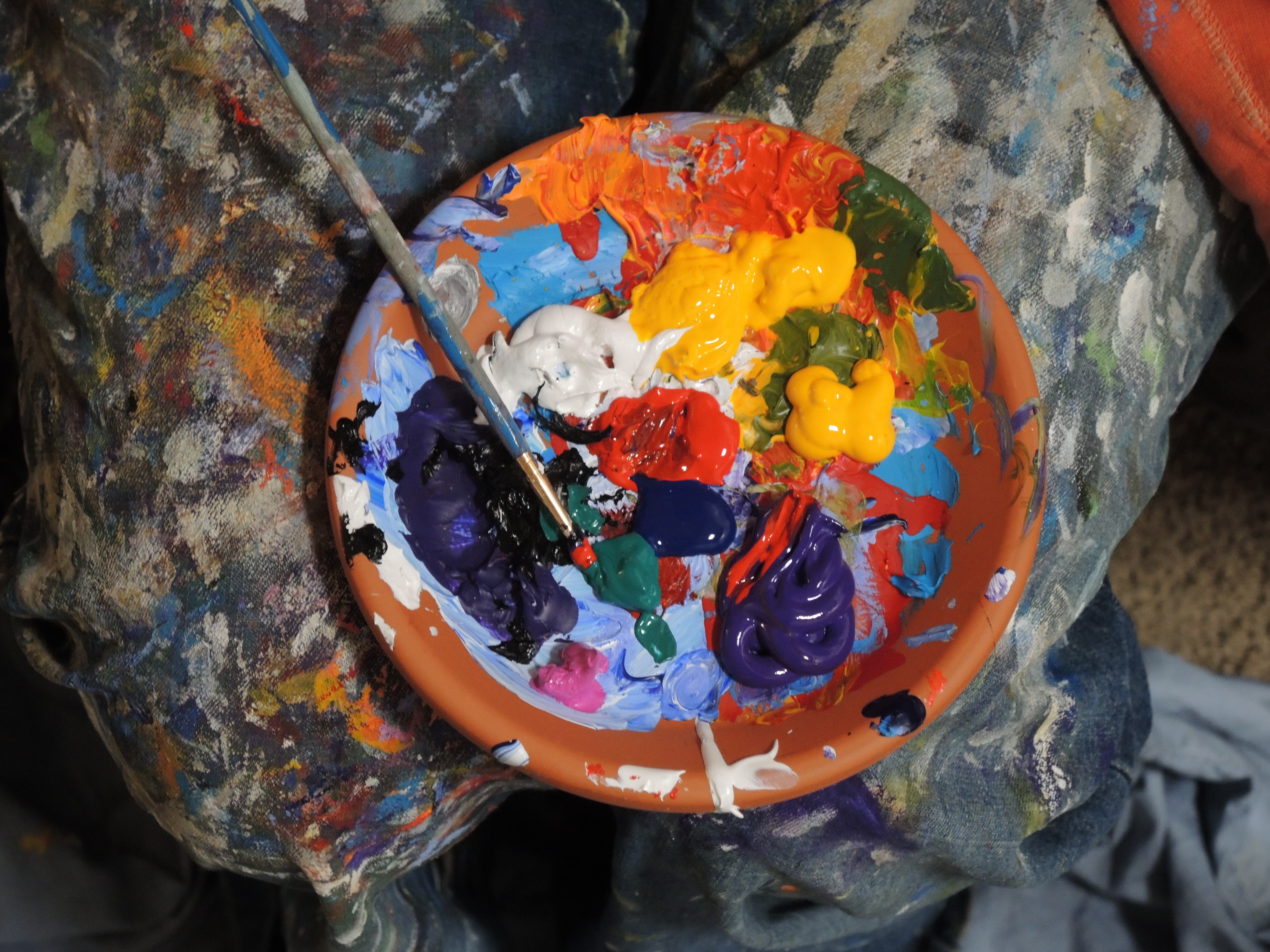 Paint pot filled with coloured paints.jpeg